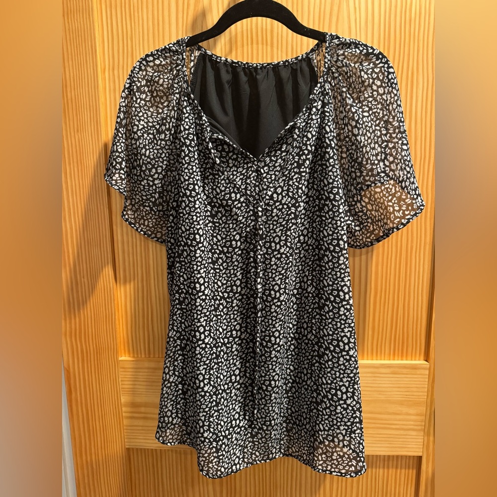 Flowy black and white blouse.